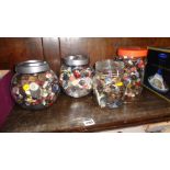 Four jars of vintage buttons