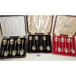 Three sets of silver cased coffee spoons - one set Harrods, hallmarked for Sheffield 1940, maker G &