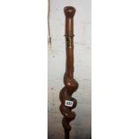 Naive carved walking stick with thick spiral stem