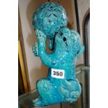 Chinese turquoise glazed stoneware Kylon with ball, 25cm high