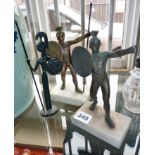 Two small bronze gladiator figures on marble bases and a stylised metal figure of a Greek warrior