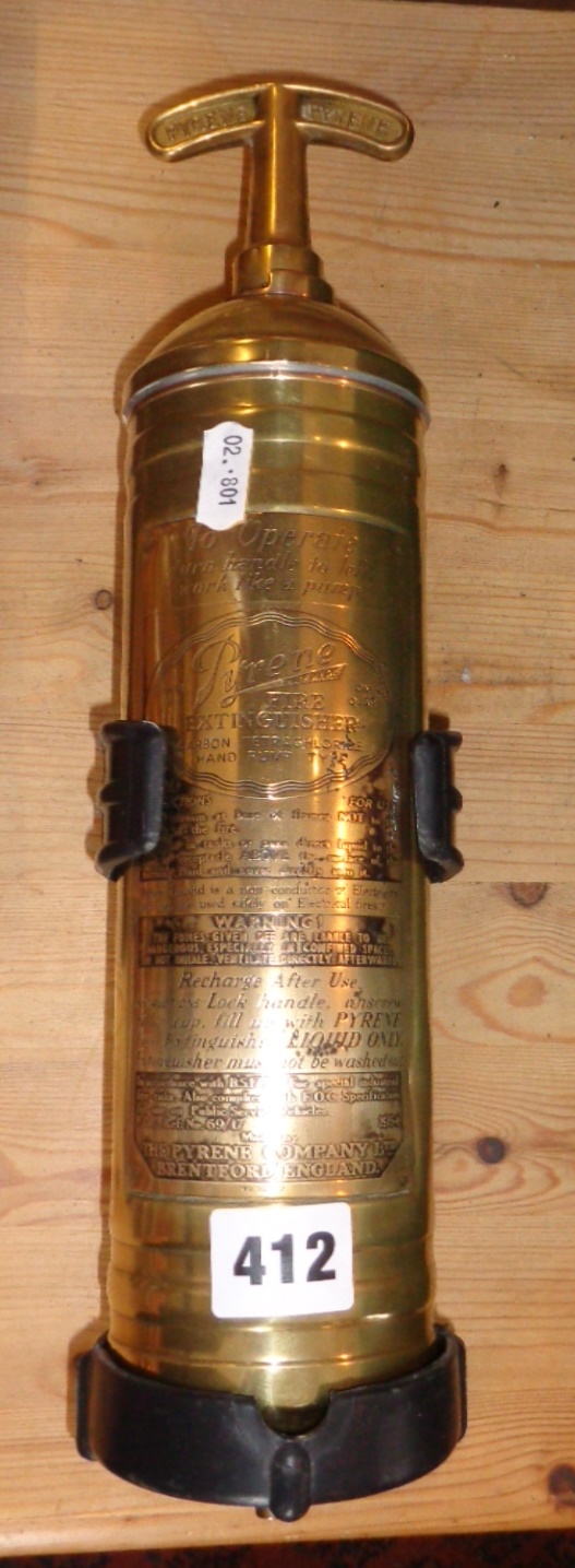 A Pyrene polished brass fire extinguisher