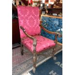 Impressive late 19th c. Continental carved walnut scroll arm open armchair with upholstered back and