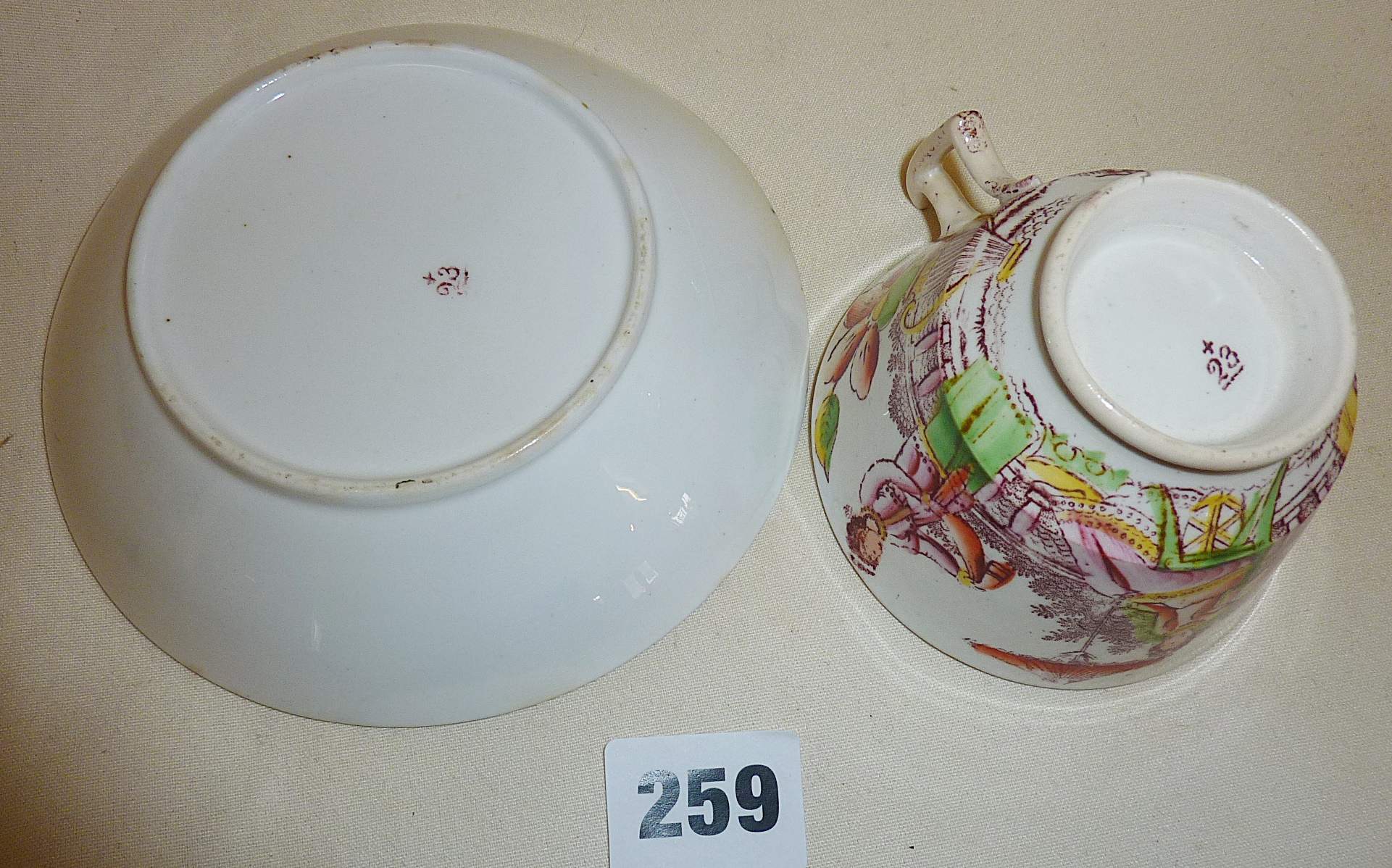 An antique English porcelain cup and saucer (A/F) - Image 2 of 2