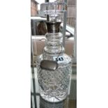 19th c. cut glass decanter with triple neck rings having silver collar and silver spirit label