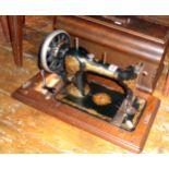 A Jones hand sewing machine in wood case, c. early 1900s