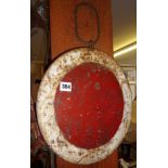 Railway iron signal disc painted red and white