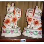 Pair of Staffordshire dogs with boy and girl seated with parrots on shoulders (one A/F)