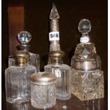 Collection of 7 hallmarked silver lidded or collared cut glass decanters, bottles and pots