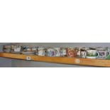 Collection of coffee cans and saucers (one shelf)