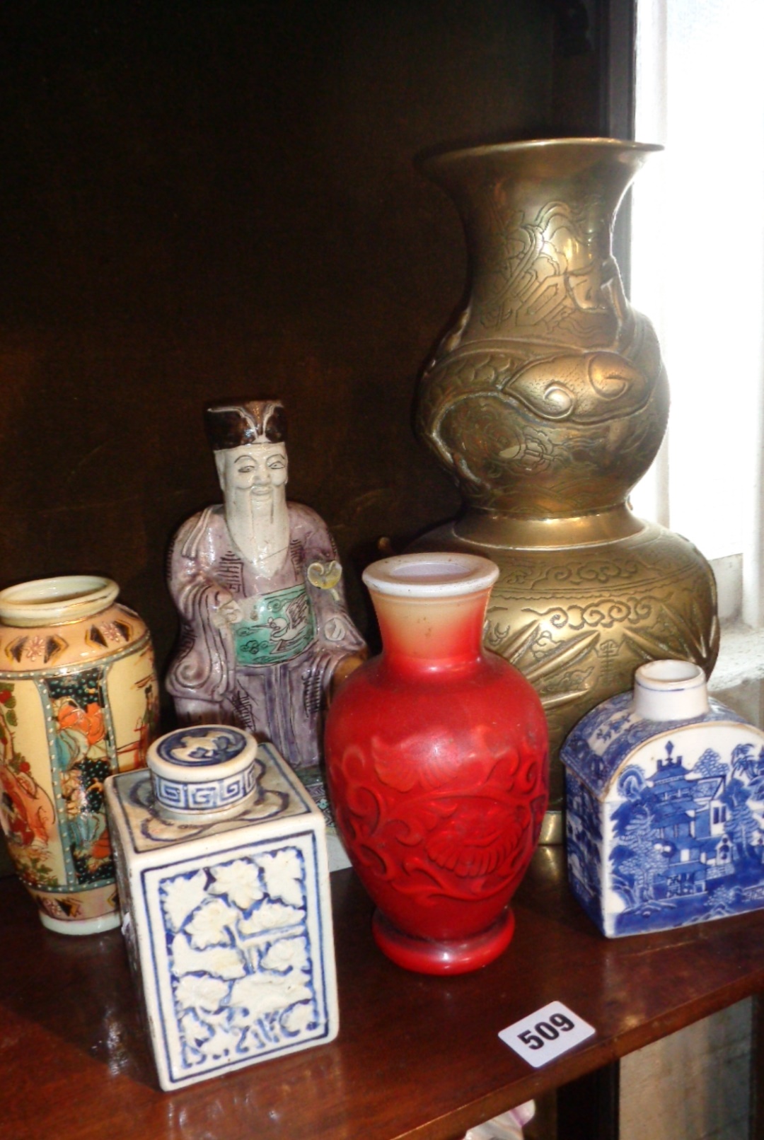 Chinese porcelain figure, a red vase, two blue & white caddies, a large brass vase, and another