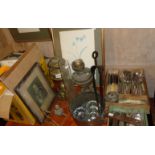 Two brass oil lamps, two trays of cutlery, a Victorian copper saucepan, boxed projector etc