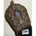 An antique Tibetan silver fronted copper backed Gau travelling Buddhist prayer shrine in a silk