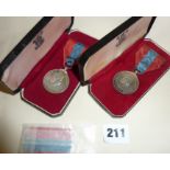 Two ER2 Imperial Service Medals in their cases - named as Horace Frederick Arthur Dell and Harold