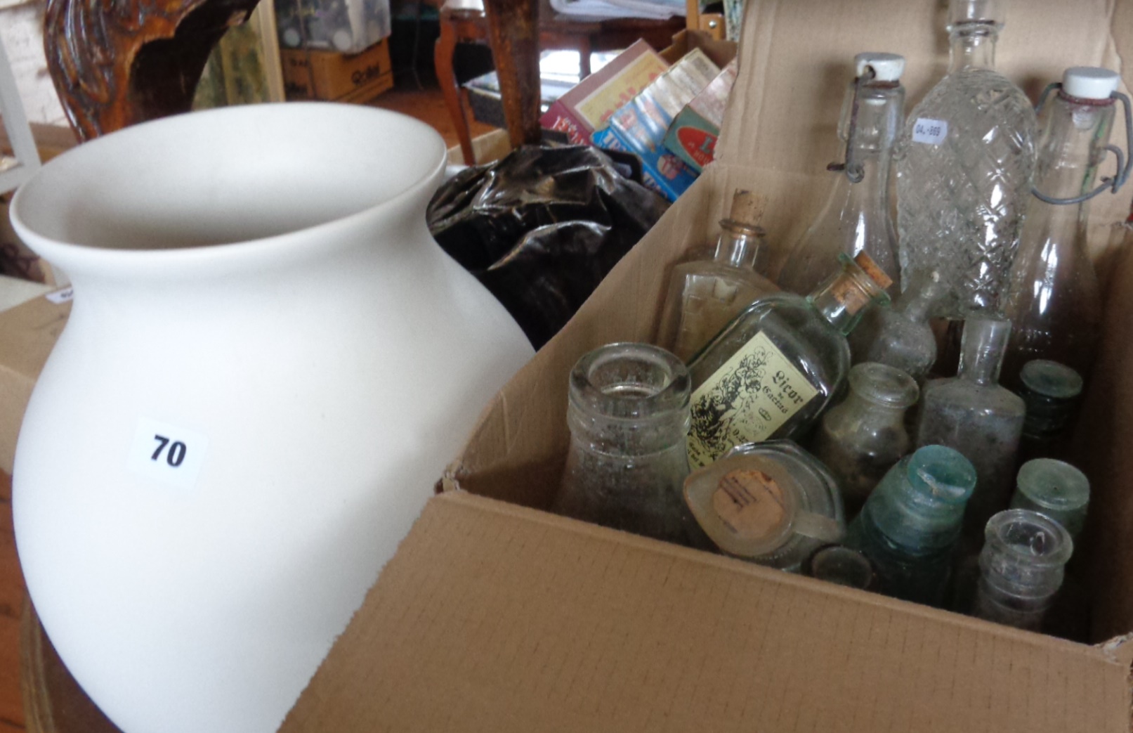 Collection of old glass bottles and a large china vase