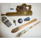 Stanley brass inclinometer, enamel badges, Mauchline Ware Sandown bookmark, carved bone letter