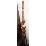 Naive carved walking stick with thick spiral stem