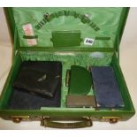 Vintage green case containing sewing and manicure sets, thimbles, needle cases, etc.