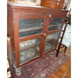 Victorian painted pine two-door bookcase on turned legs