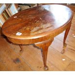 Oval walnut coffee table