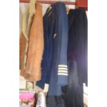 Vintage clothing: A British Caledonian pilot's tunic, a gent's tailcoat and a sheepskin jacket