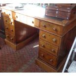 Victorian oak pedestal nine drawer kneehole desk with leather inset top and turned bun handles