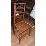19th c. ash and elm ladder back side chair with solid seat above turned legs with pad feet