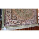 Modern Keshan rug on green ground, 2.00m x 1.40m