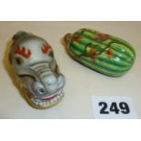 Two Chinese porcelain snuff bottles, one shaped as a dragon's head, the other as a gourd, both