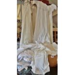 Large collection of Victorian lacework and linen christening gowns