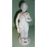 White glazed china figurine of a Dutch boy, Naples mark in blue to base