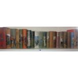 Shelf of Adventure story books with decorated cloth covers
