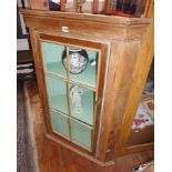 Victorian stripped pine corner cupboard with single glazed door