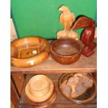 Group of turned wood fruit and other bowls with a carved hornbill bird and an eagle