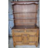 Reproduction oak dresser with linenfold panelled doors