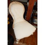 Victorian spoonback nursing chair with white washed finish, and re-covered in an ivory linen fabric