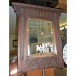 19th c. carved oak wall mirror with bevelled edge glass