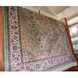 Modern Keshan rug on pale green ground, 2.00m x 1.40m