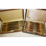 Two cased sets of early 20th century cutlery:- 12 French Art Deco table knives with faux horn