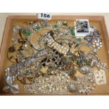 Tray of assorted vintage jewellery including carved Chinese pendant