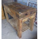 Large old pine butcher's block on square legs with slatted undertier