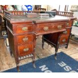 Victorian mahogany breakfront kneehole desk with galleried top above single drawer flanked by six