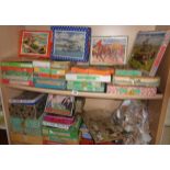 Collection of assorted old wood jigsaws (2 shelves)