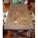 African carved hardwood coffee table on 'X'-frame base