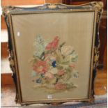 Large Victorian woolwork picture of still life of flowers in a basket and a parrot