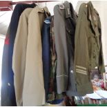 Nine various military uniforms