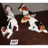 Four Royal Doulton Beagle or Fox Hound figurines