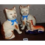 Pair of pottery cats and a Staffordshire Greyhound