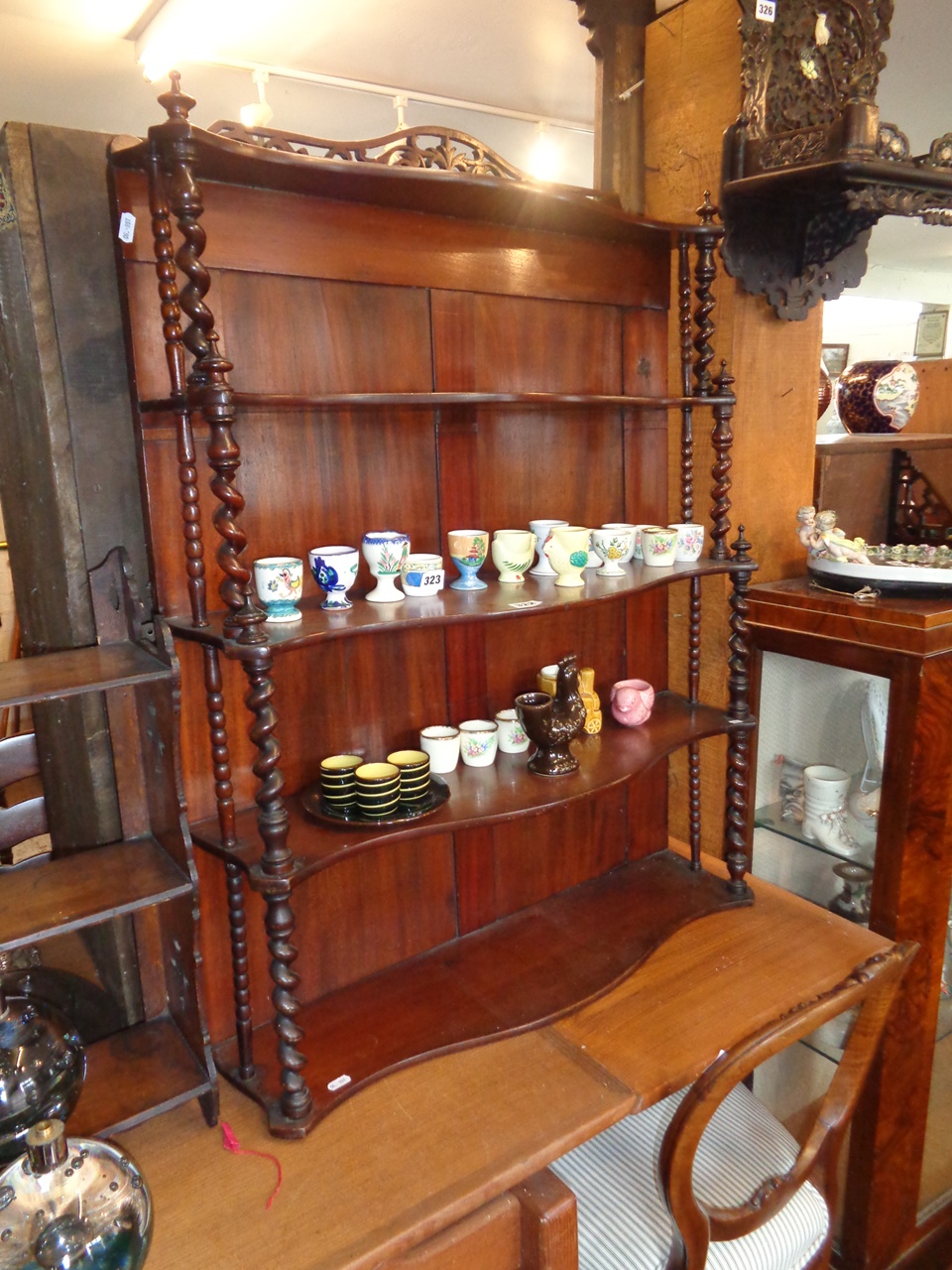 Victorian mahogany wall shelves having shaped shelves on barley twist column supports and fretwork