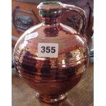 Copper lustre pottery flagon